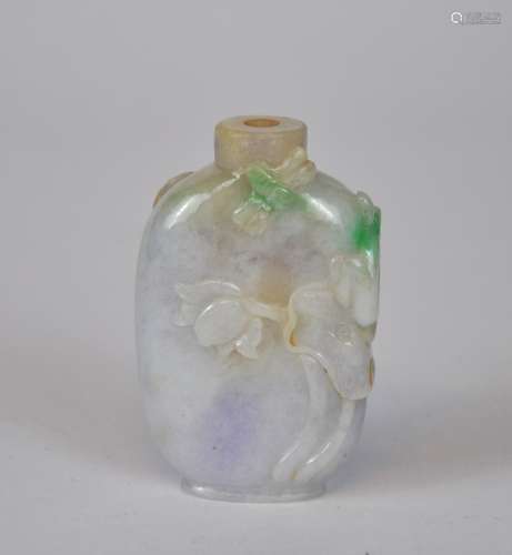 A Chinese jade snuff bottle carved with lotus, lavender & gr...