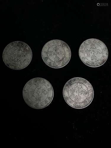 Five silver dollars