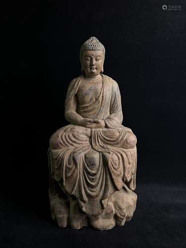 Wooden sculpture of seated Buddha