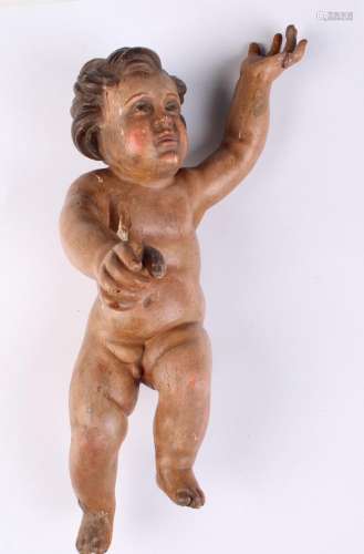 Putto en bois sculpté, stuqué et peint, dans le goût it