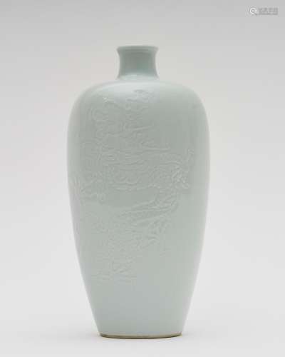 A white-glazed 'dragon' vase Kangxi six-character ma...
