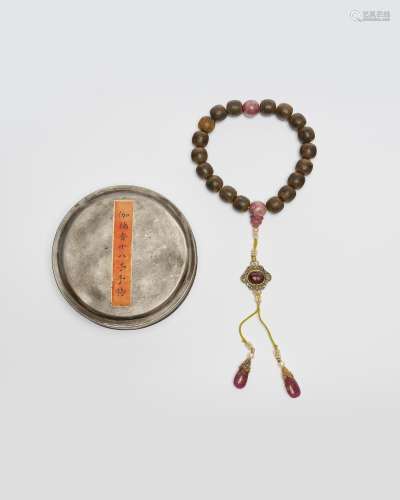 A set of aloeswood and rose quartz praying beads