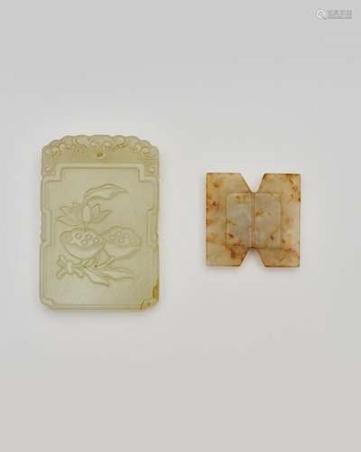 A celadon jade plaque, and a mottled jade pendant the pendan...