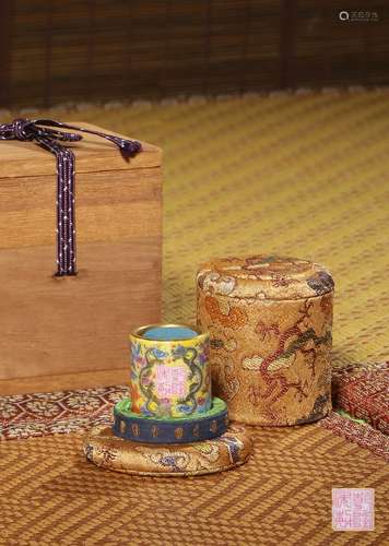 A FAMILLE-ROSE YELLOW-GROUND ARCHER'S RING,MARK AND PERIOD O...