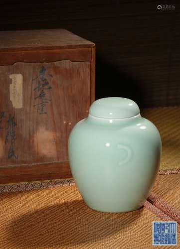 A CELADON-GLAZED JAR AND COVER,MARK AND PERIOD OF QIANLONG