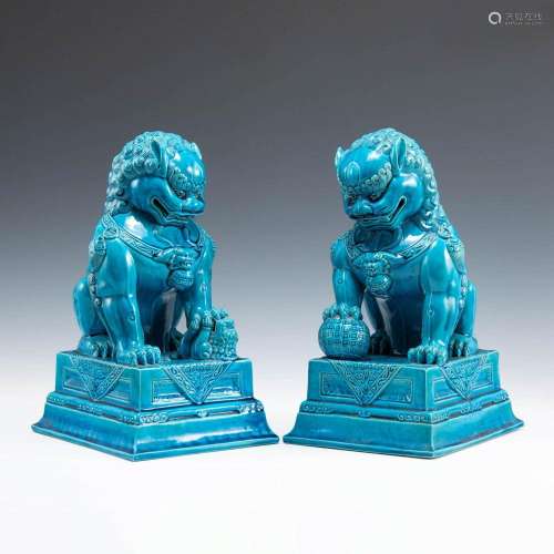 A pair of Chinese turquoise-glazed guardian lions, late 19th...