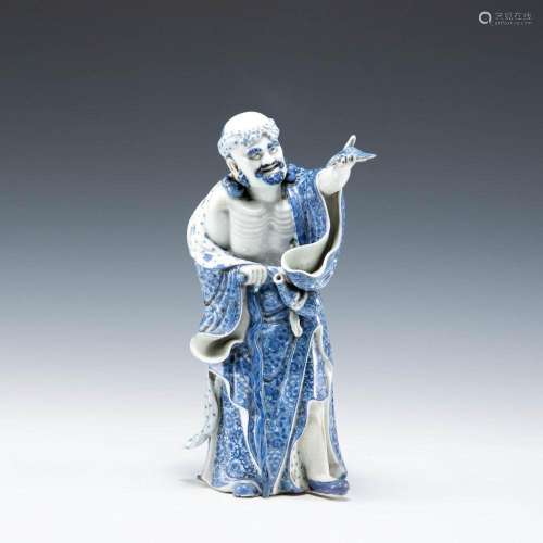 A Chinese blue and white porcelain sculpture of Tieguai Li, ...