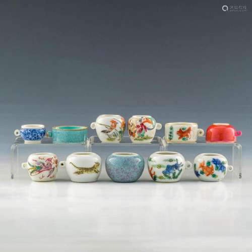 A group of eleven Chinese porcelain bird feeders, late Qing ...
