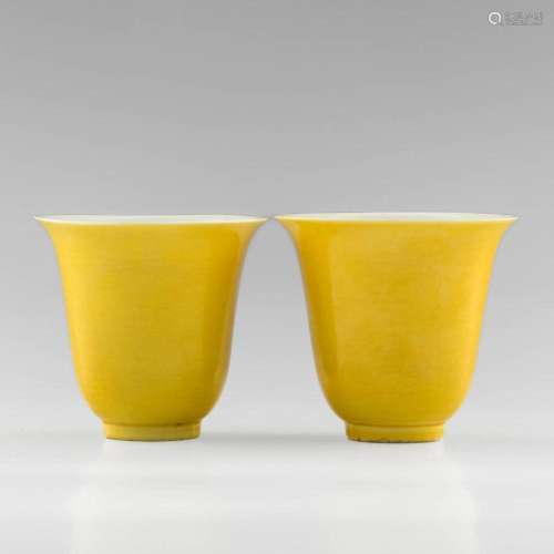 A pair of Chinese yellow-glazed bell-form cups, 18th/19th ce...