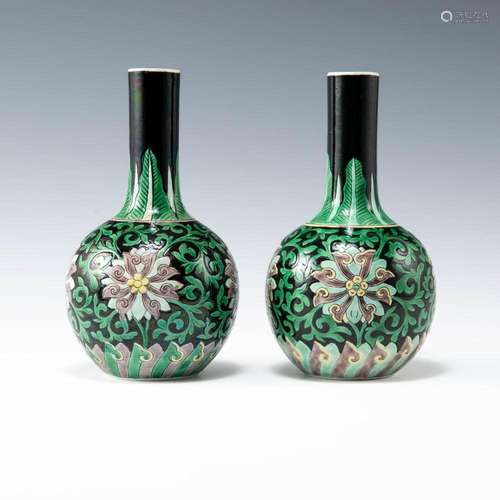 A near pair of Chinese black-ground sancai tianqiu vases, la...