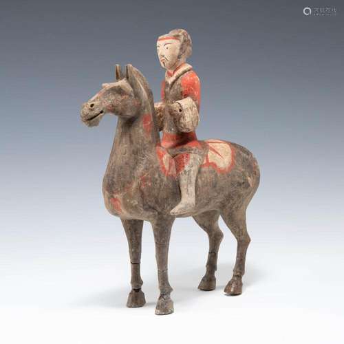 A Chinese pottery figure of an equestrian, Western Han dynas...