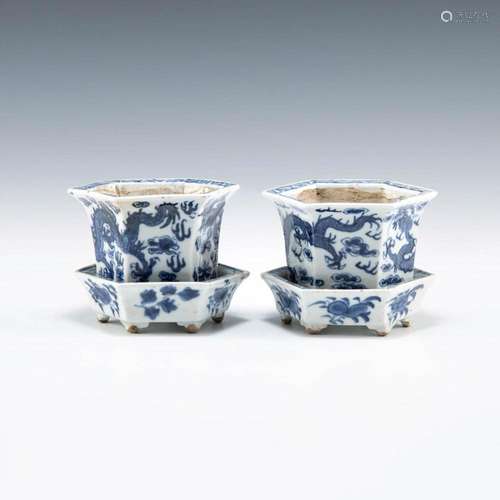 A pair of Chinese blue and white hexagonal dragon jardiniere...