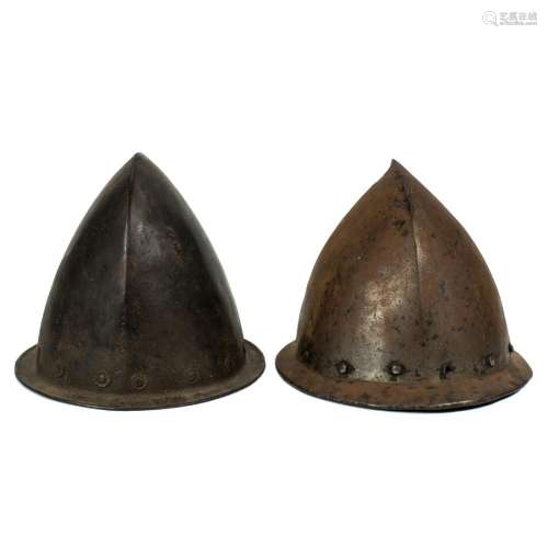 Two Spanish hand wrought metal Cabasset helmets, each with &...