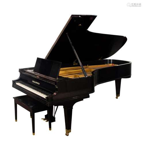 A Balwin concert grand piano, Serial #160419, of typical for...