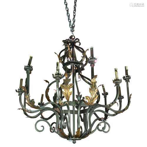 A pair of Spanish Colonial style twelve-light hanging fixtur...