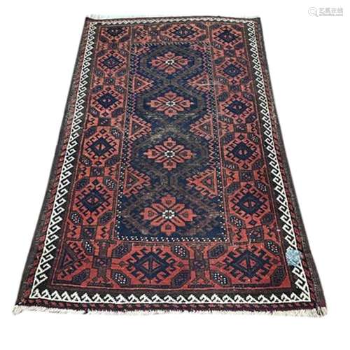 An antique Afghan carpet