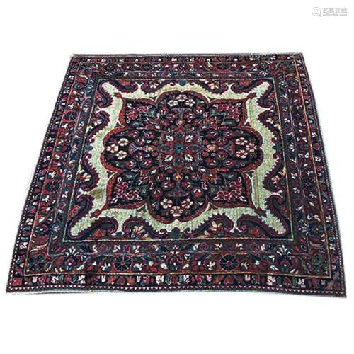 A Persian Sarouk mat