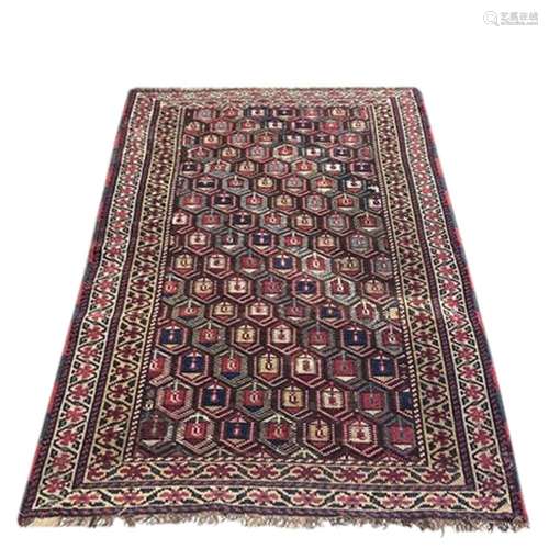 An antique Caucasian carpet