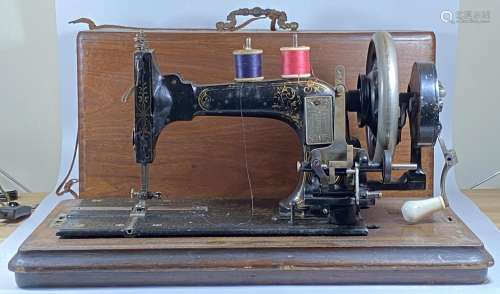 A VINTAGE CASED FRISTER & ROSSMANN SEWING MACHINE