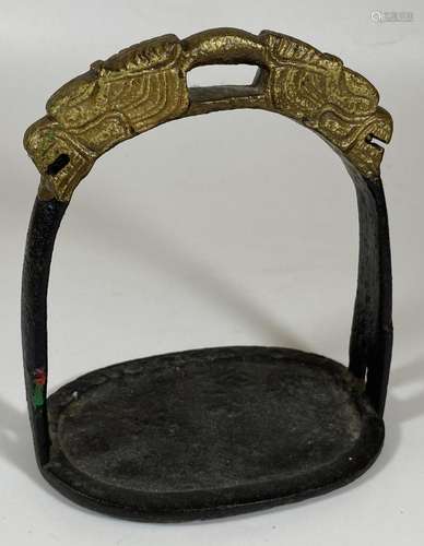 A SOLID CAST IRON ORIENTAL STIRRUP WITH DRAGON HEAD DESIGN, ...