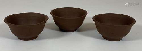 A SET OF THREE CHINESE YIXING STYLE CLAY TEA BOWLS, DIAMETER...