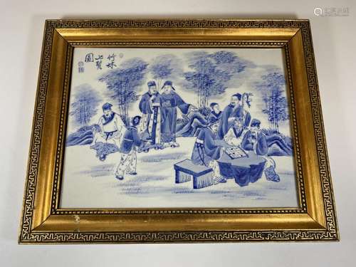 A GILT FRAMED CHINESE BLUE AND WHITE PORCELAIN PLAQUE WITH S...