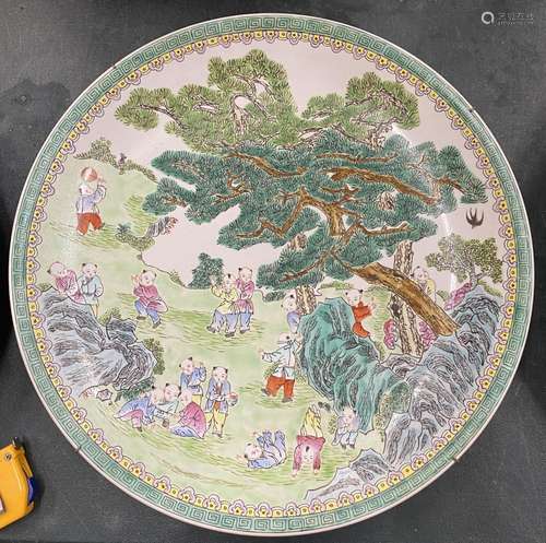 A LARGE CHINESE FAMILLE VERTE CHARGER WITH BOYS AT PLAY SCEN...