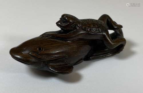 AN ORIENTAL NETSUKE OF A TURTLE MONKEY RIDING A NAMAZU (EART...