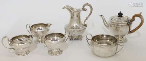 A group of silver, comprising: a Victorian milk jug, London,...