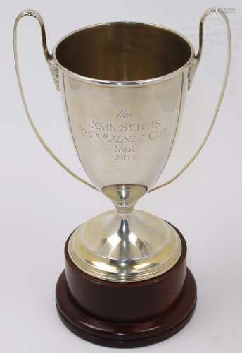 A twin handled silver gilt trophy cup, London, 1982, Garrard...