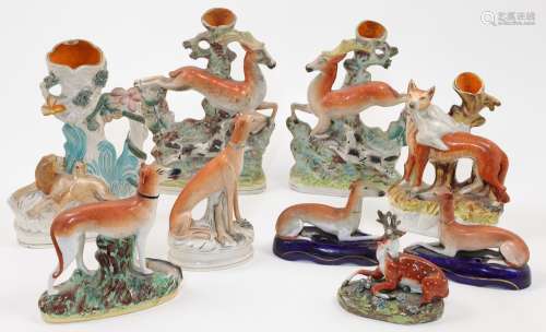 A group of eight Staffordshire ceramic flatback figures, vas...