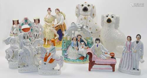 A collection of Staffordshire pottery, flatback figures, and...