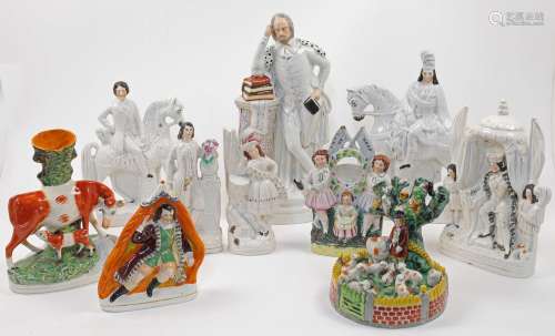 A collection of Staffordshire pottery, flatback figures, and...