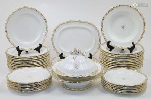 A Minton porcelain white and gilt highlighted armorial part ...
