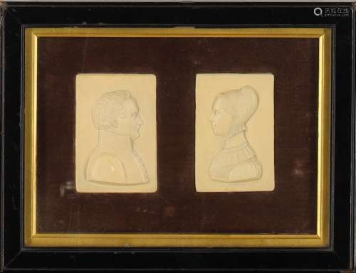 A pair of plaster portrait high relief plaques, early 19th c...