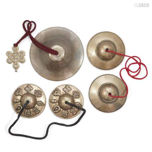 Two pairs of Tibetan bronze cymbals and a hanging bell, ting...
