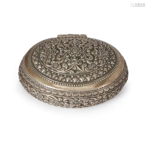 A Thai repousse silver box, early 20th century, of oval shap...