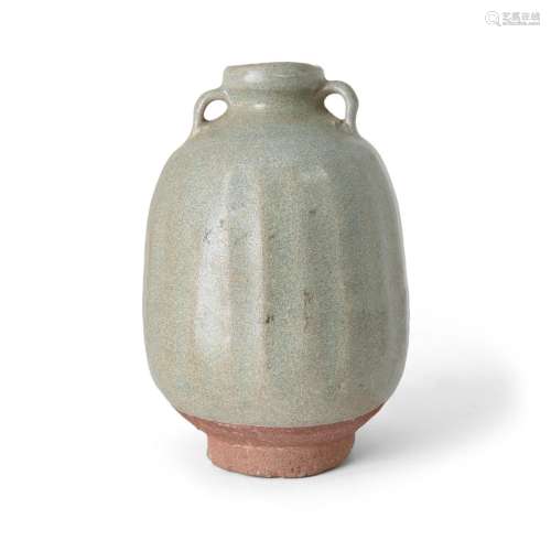 A Thai Sawankhalok celadon-glazed fluted jar with paired lug...