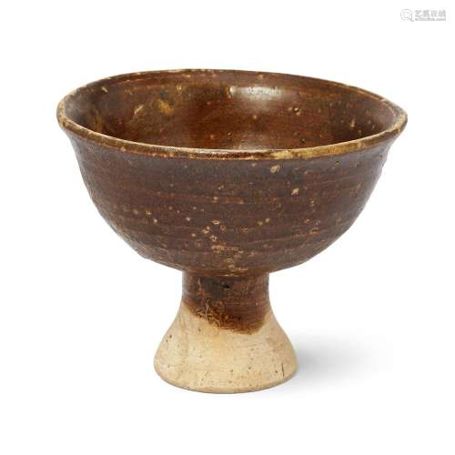 A Chinese brown-glazed stem bowl, Ming dynasty, the thickly ...