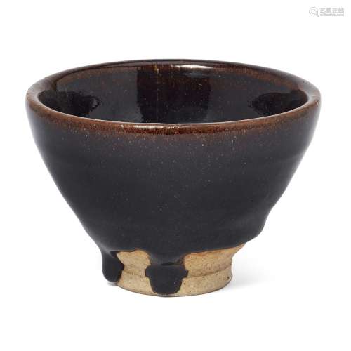 A Chinese Henan black-glazed tea bowl, Jin dynasty, of conic...