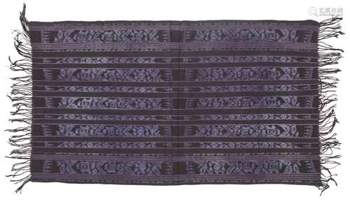 A cotton textile, Indonesia, 20th century, woven in purple a...