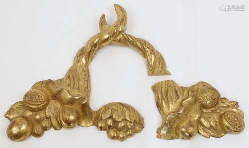 A carved giltwood wall mount designed as two intertwined cor...