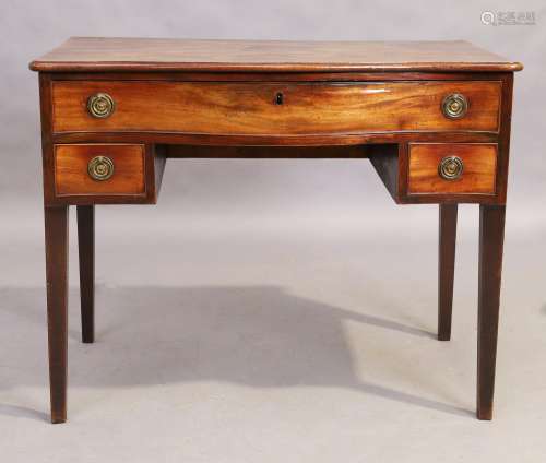A George III serpentine mahogany dressing table, last quarte...