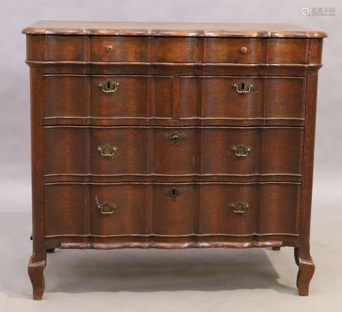 An English scalloped front oak chest, Jacobean style, 20th c...