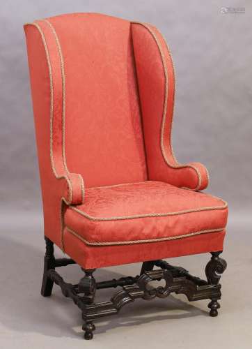 An English mahogany framed wingback armchair, William and Ma...