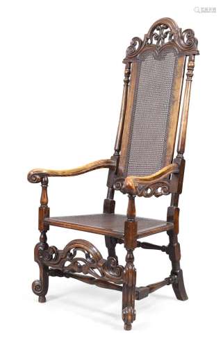 An English caned walnut armchair, in the William and Mary st...