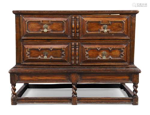 An English oak chest on stand, 18th century,the two long dra...