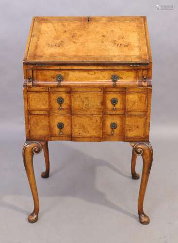 An English walnut and feather banded bureau, Queen Anne styl...