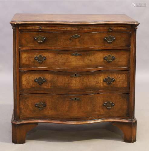 An English walnut serpentine front chest, George II style, f...