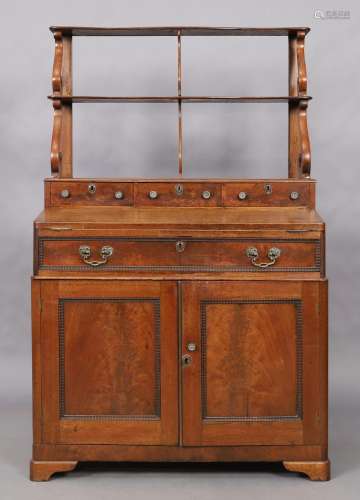 An English mahogany bureau bookcase, 19th century, the open ...